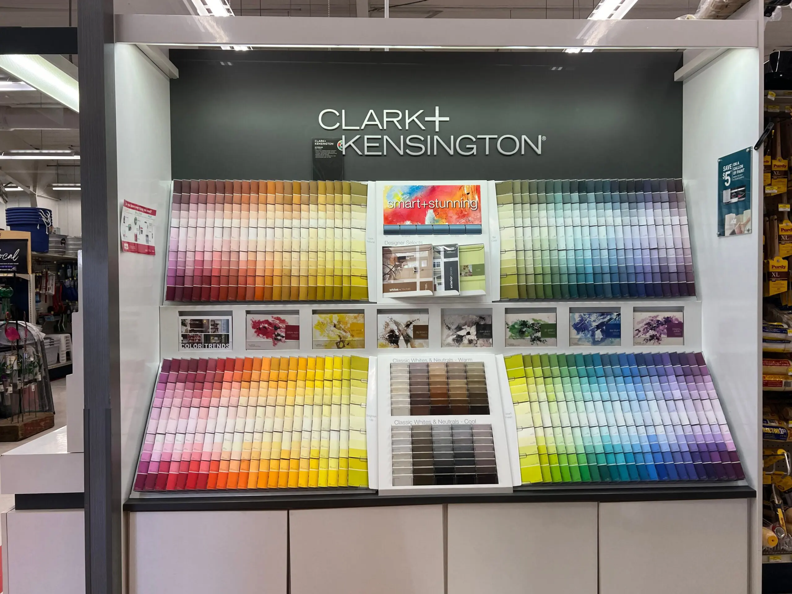 A display of paint samples in front of the clark + kensington sign.