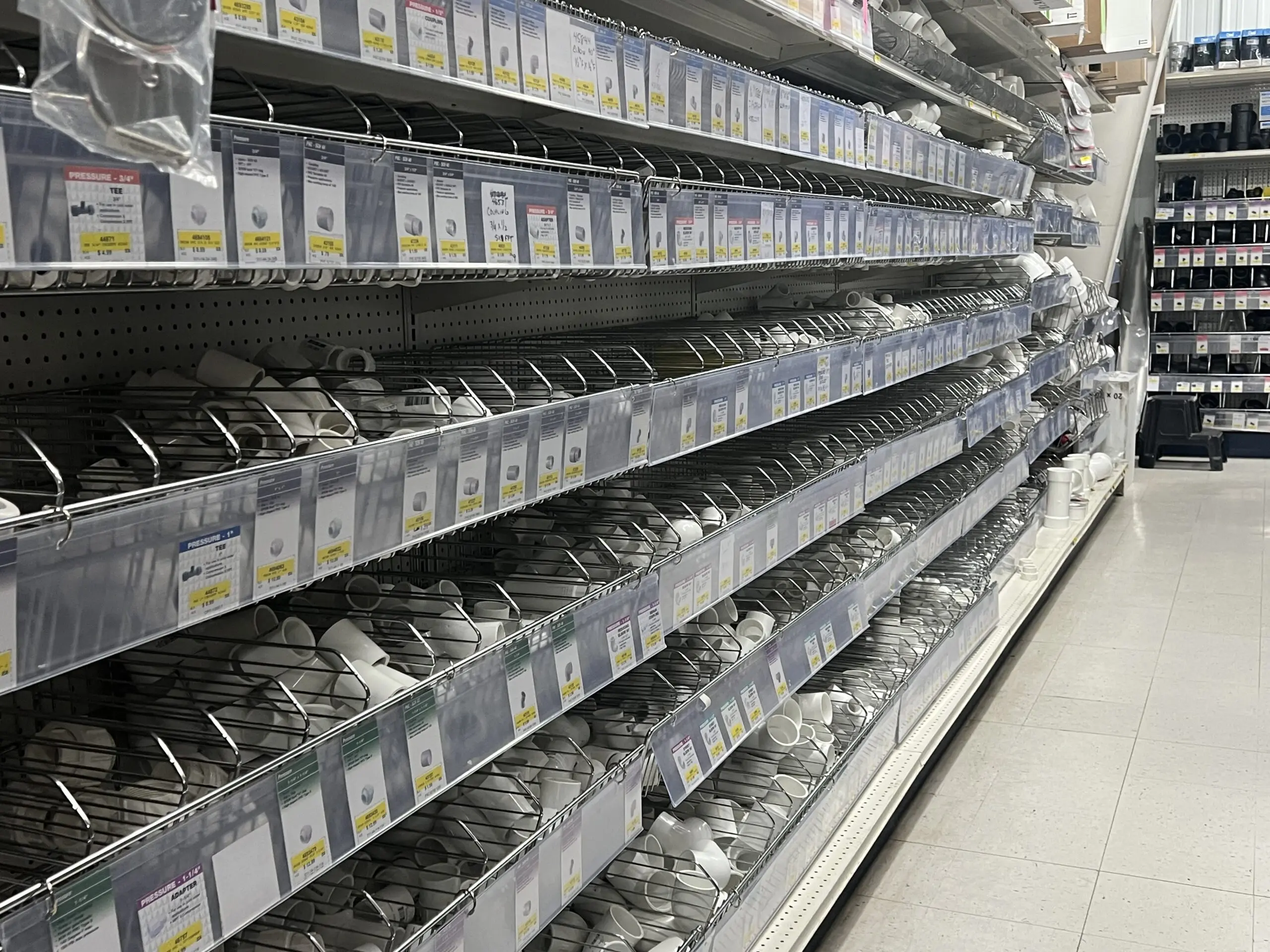 A store shelf filled with lots of different types of hardware.