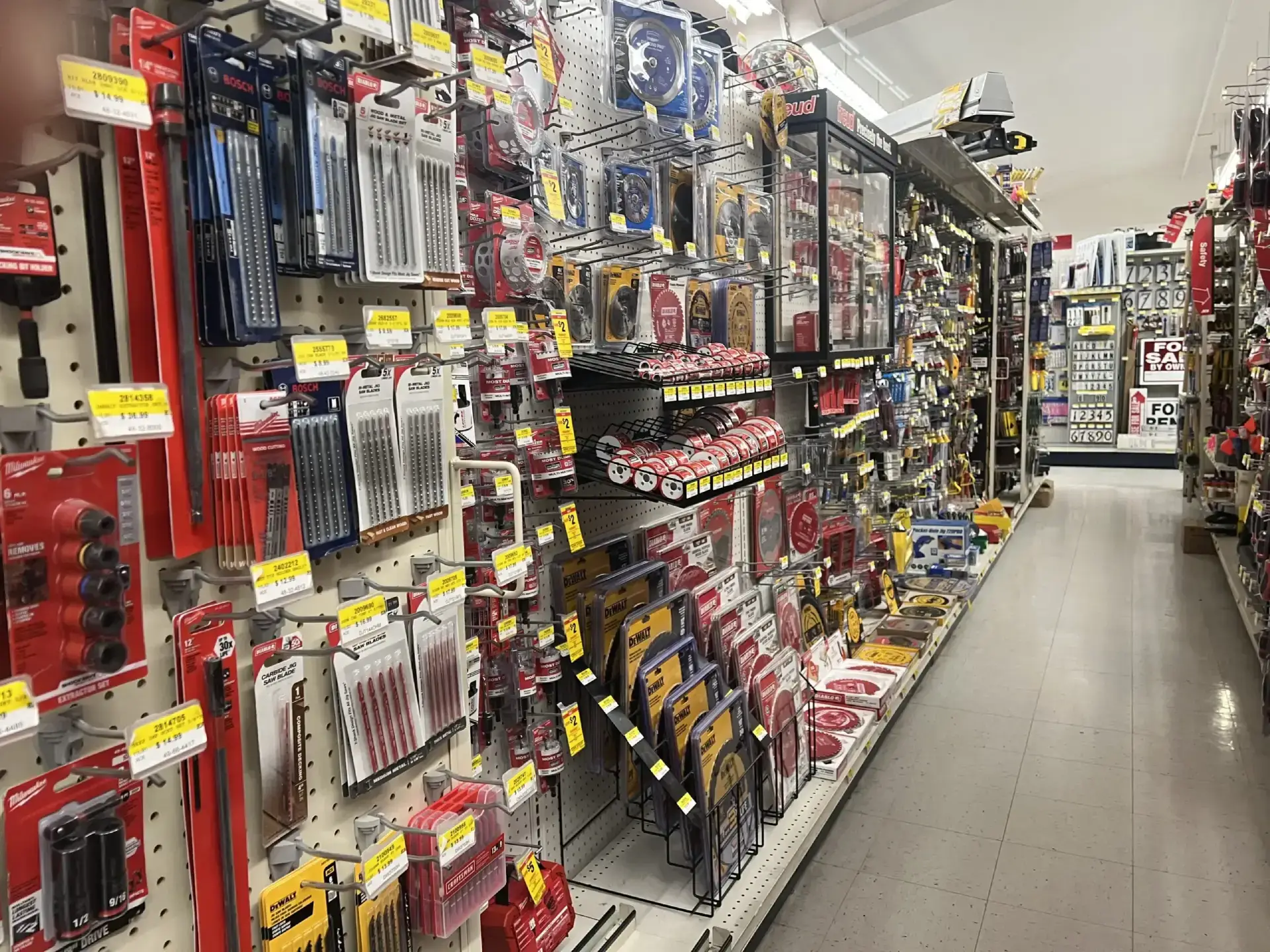 Hardware store aisle stocked with drill bits